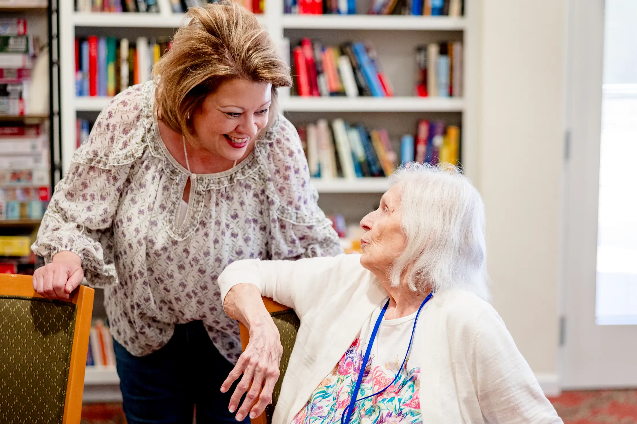 Bear Creek care team member smiling with a resident.